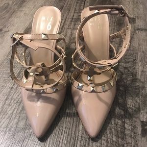 Nude stud strap heel.